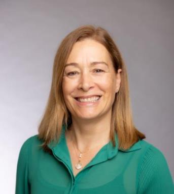 Debbie Umbach smiling in a green blouse